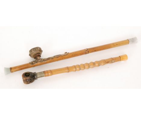 A Chinese opium pipe with bamboo stem and brass fittings, pottery bowl and green hardstone ends, length 55cm, and a similar p