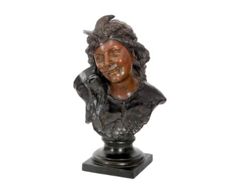 An early 20th Century Bretby bronzed effect sculpture modelled as a female bust wearing a fish scale breast plate with a fril