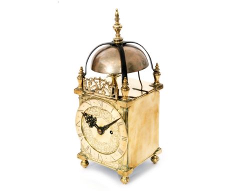 A late 17th to early 18th Century brass lantern clock with converted key wind barrel movement below a bell mounted with a bra