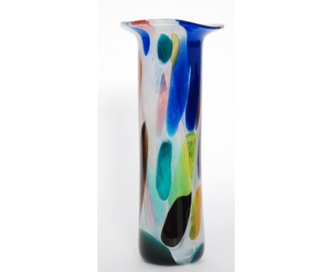 A large studio glass vase by Will Shakespeare of sleeve form with a flared rim decorated with multicoloured spotting within t