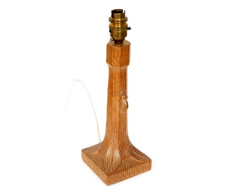 A Robert 'Mouseman' Thompson oak table lamp base, the shaped column to a square base with carved 'mouse' signature, height 31