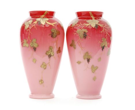 A pair of late 19th Century Harrach Peachblow vases of footed, shouldered ovoid form with collar necks, cased in a graduated 