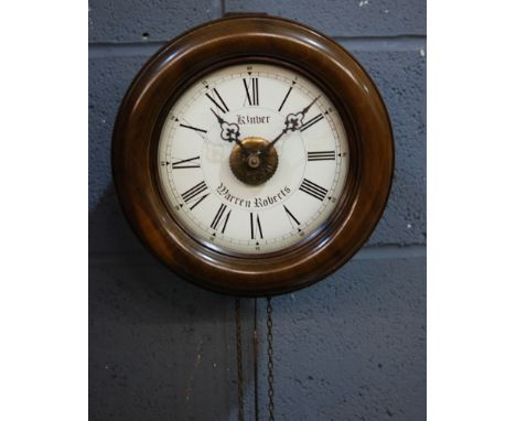 A late 19th Century and later converted postman's alarm clock, the dial named Warren Roberts Kinver, height 27cm