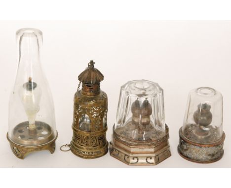 A Chinese travelling brass opium lamp with internal glass cover within a pieced case, height 19cm, together with two faceted 