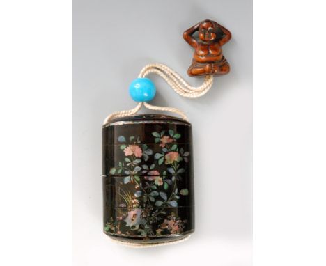 A late 19th Century Somada type three case inro the roiro ground inlaid with aogai (mother of pearl) peonies growing from roc