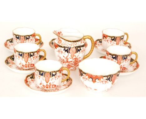 A set of six early 20th Century Royal Crown Derby Imari 2412 pattern breakfast cups and saucers together with a matching suga