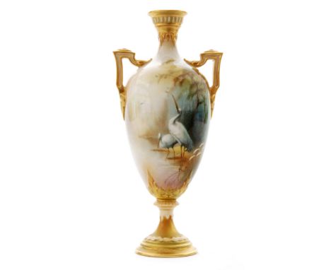 An early 20th Century Royal Worcester shape 247 twin handled vase decorated by Arthur Lewis with two hand painted wading stor