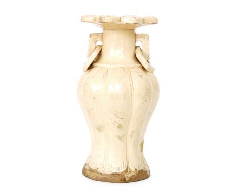 A Chinese Ming Dynasty or later vase of fluted baluster form with collar neck and petal edged rim, decorated with applied hex