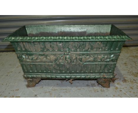 A Victorian style and later green painted cast iron rectangular trough decorated with acanthus and dentil border on bracket f