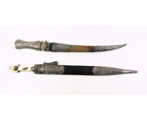 Eastern European short sword with a double fullered double sided 39.7cm steel blade and silver mounted and bone hilt with bla
