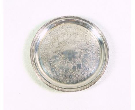 Victorian silver waiter with chased and engraved floral decoration within a beaded rim, on 3 shell feet, by Edward Hutton, Lo