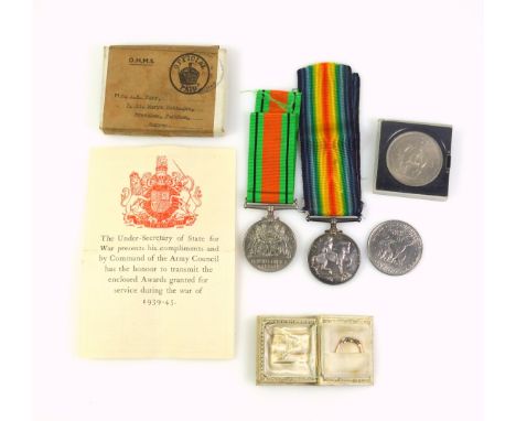 18ct gold and platinum crossover ring with an illusion set diamond and 2 marcasites, 1.5grs, in a "book" case; WWI War Medal 
