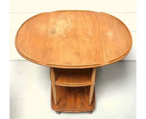 Ercol elm trolley, the galleried top with 2 semi-circular drop leaves, and 2 galleried tiers below, on shepherd castors, 76 x