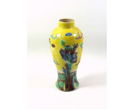 Chinese Famille Jaune porcelain baluster vase, decorated in relief with Qilins in a mythical setting, 4 character Wang Bing R