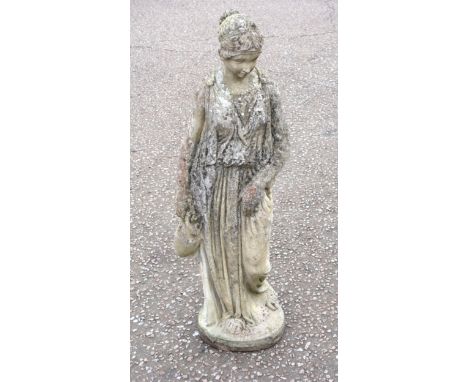 Composition garden figure of a classical young woman holding a pitcher, standing on a shaped oval base, H.100cm