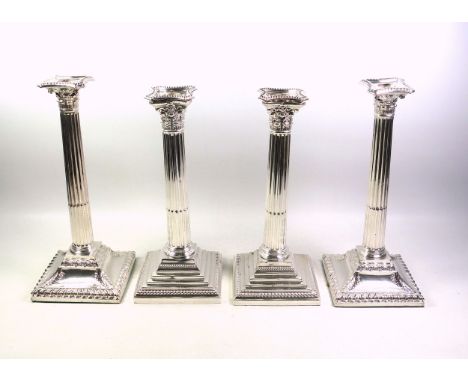 Pair of Victorian silver plated Corinthian Column candlesticks, each with a removable beaded drip tray, stop fluted column, o