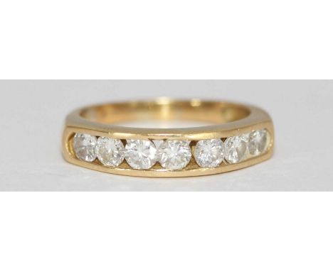 An 18ct yellow gold seven-stone diamond ring, open channel-set in a line, rbc diamonds, estimated total diamond weight 0.60 c