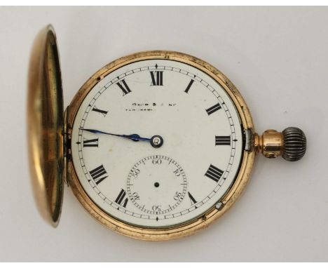 A 9ct gold triple cased half hunter pocket watch, the white enamel dial with Roman numerals denoting hours, subsidiary second
