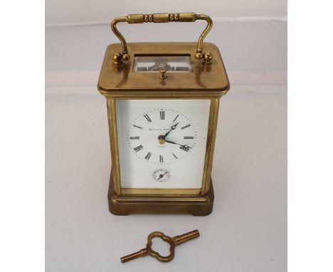 A Matthew Norman brass-case eight-day carriage clock, striking a gong, with alarm and strike repeat feature, bevelled glass, 