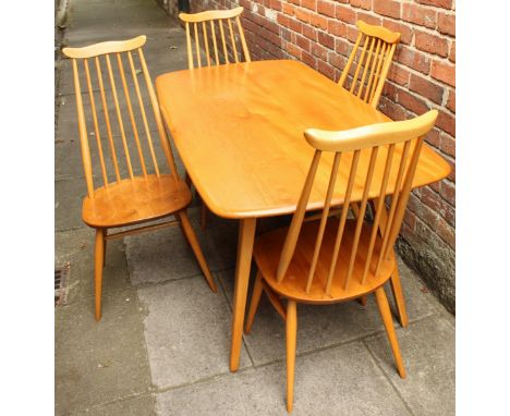 An Ercol light elm dining table, with single piece top and raised on square, tapering supports, 150cm, together with a set of