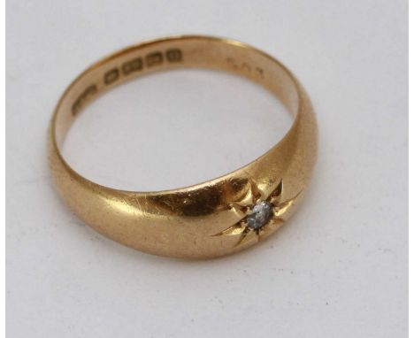 An early 20th century 18ct gold gypsy style ring, of tapering band design set with a small 'Old Cut' diamond, 5.07grms