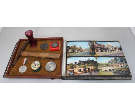 An album of approximately 170 postcards, mixed subjects but predominantly of topographical interest, monochrome and colour ex