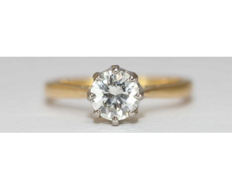 An 18ct Yellow Gold and Solitaire Diamond Ring, claw-set a round brilliant cut diamond weighing approximately 3/4 carat (0.75