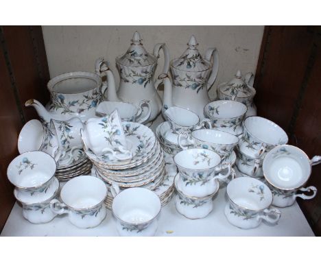 SECTION 31. A 49 piece Royal Albert 'Brigadoon' pattern tea and coffee service, comprising of a teapot, a coffee pot, cups, s