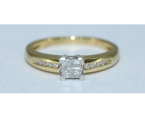 An 18ct gold diamond ring, four calibre-cut diamonds with corner claw mount, channel set to the shoulders and plain half band