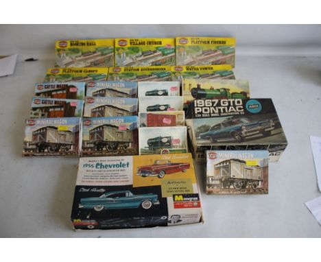 EIGHTEEN BOXED OO GAUGE RAILWAY AIRFIX KITS OF TANKS, WAGONS, BUILDINGS ETC. and Airfix Pontiac 1/24 scale construction kit a