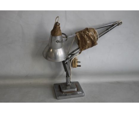 A VINTAGE "'HERBERT TERRY OF REDDITCH"' ANGLE POISE DESK LAMP. chrome base and arm, with aluminium shade.