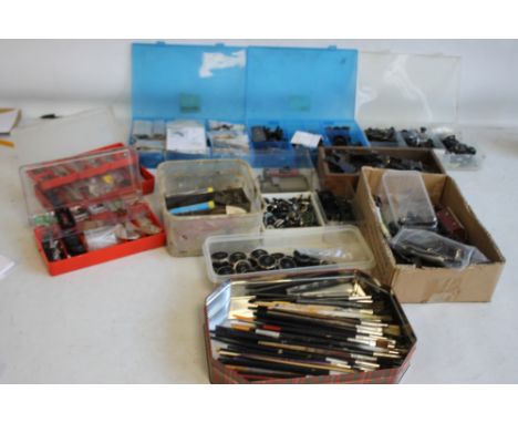 A BOX OF OO GAUGE SPARE PARTS, tools, brushes etc.