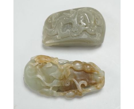 A Chinese green and russet green and brown jade carving of gourd and a green jade pebble carved in relief with a dragon, larg