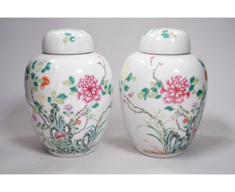 A pair of Chinese famille rose jars and covers, Qianlong seal marks, late 19th century, 20cm high