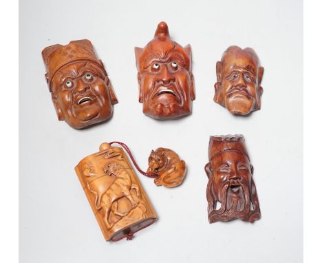 A group of hardwood models of noh masks and a similar inro, 9cm and netsuke