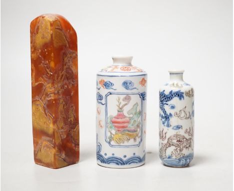 Two Chinese porcelain snuff bottles and a Chinese soapstone seal, 12.7cm