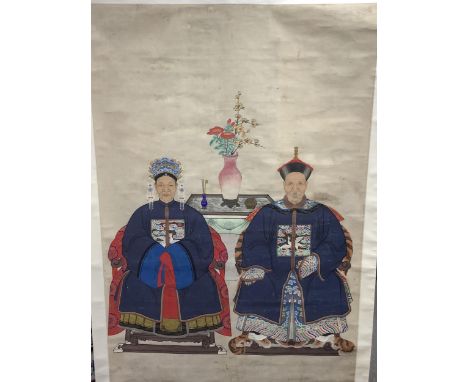 A Chinese ancestor scroll painting on paper, late Qing dynasty, depicting a husband and wife, wearing formal robes, seated on