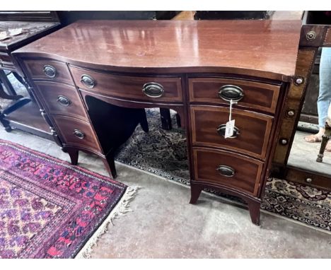 A reproduction 'Drexel Furniture' serpentine mahogany kneehole dressing table, width 117cm,  width 51cm, height 77cm