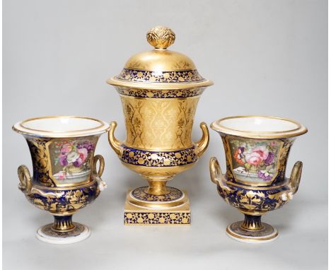 A pair of Derby flower basket painted urns, c.1810, and a larger Derby urn and cover, first quarter 19th century, latter 30cm