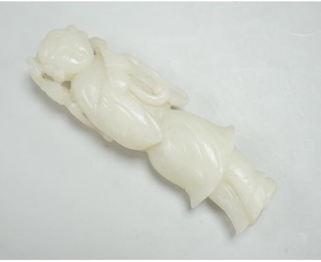 A Chinese white jade figure of a lady holding a sprig of fungus, 10cm high