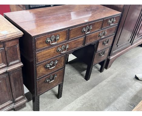 A George III Chippendale style mahogany blind fret kneehole desk, width 112cm, depth 48cm, height 87cm.