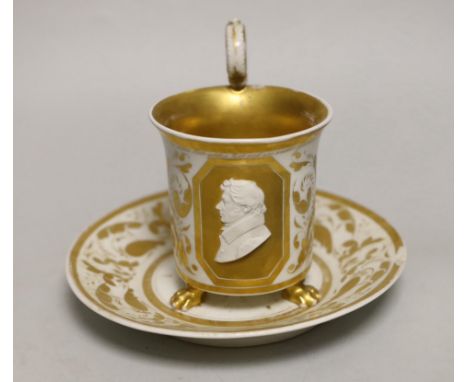 A Berlin porcelain cameo portrait cup and saucer, first half 19th century, cup 13cm to top of handle