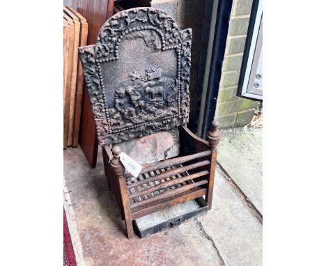 A small cast iron fire grate, width 33cm, depth 23cm, height 66cm