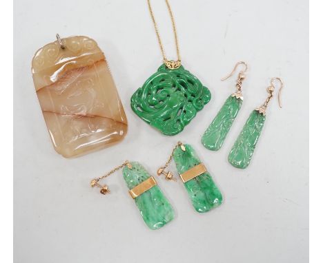 A Chinese carved hardstone pendant, 64mm, a pierced green hardstone pendant on chain and two pairs of yellow metal mounted ca