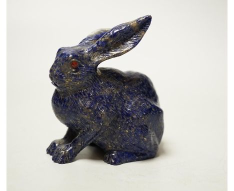 A Chinese lapis lazuli model of a hare, with glass inset eyes, 8.4cm high