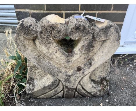 A Portland stone carved corbel, width 50cm, height 47cm