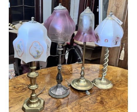 Two Edwardian silver plated and brass table lamps with etched cranberry shades and two converted candlestick lamps, tallest 5