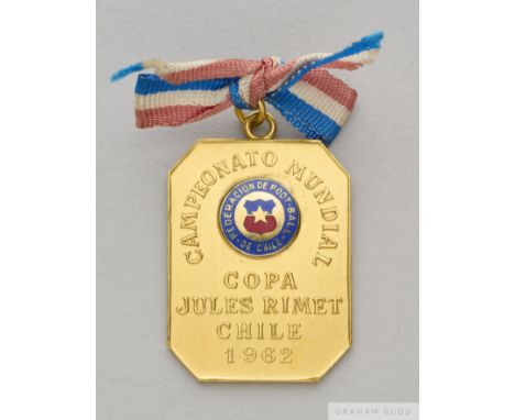 A yellow metal medal presented by the Chile Football Association to Ottorino Barassi on the occasion of the 1962 World Cup, w