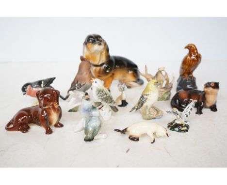 Collection of ceramic figures to include Goebels, Beswick & others 
