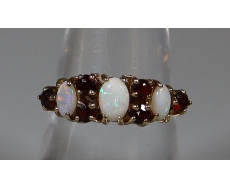 9ct gold Victorian design opal and garnet dress ring. 2.5g approx.(B.P. 21% + VAT) 